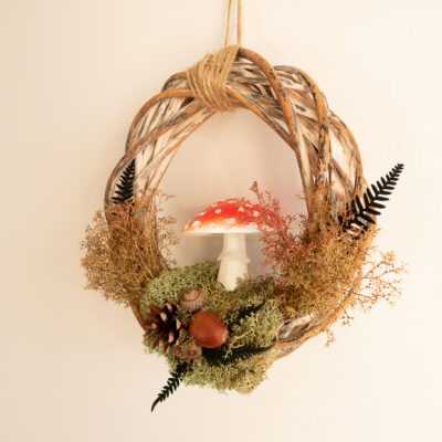 a wreath with mushrooms and moss